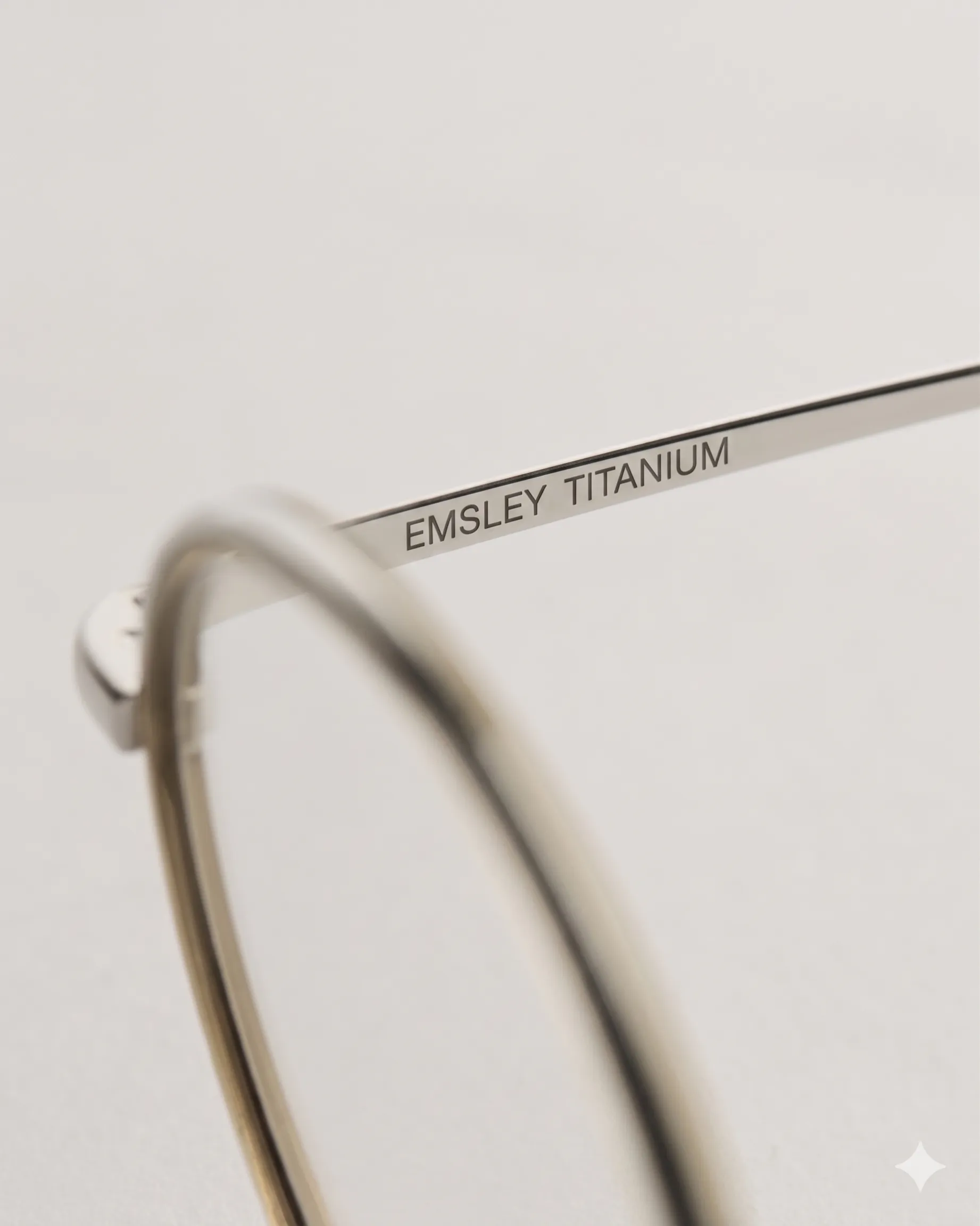 Titanium temple arm with engraved Emsley branding