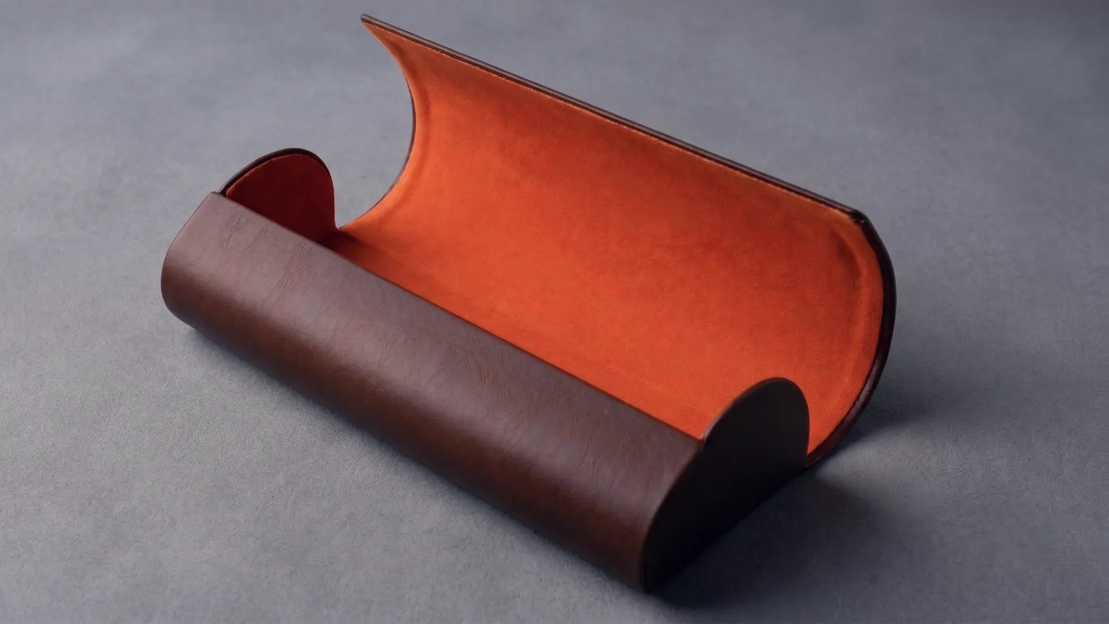 Oxblood leather case with orange suede interior.
