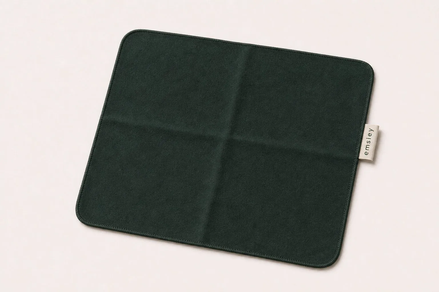 Racing green microfibre cloth with woven tab.