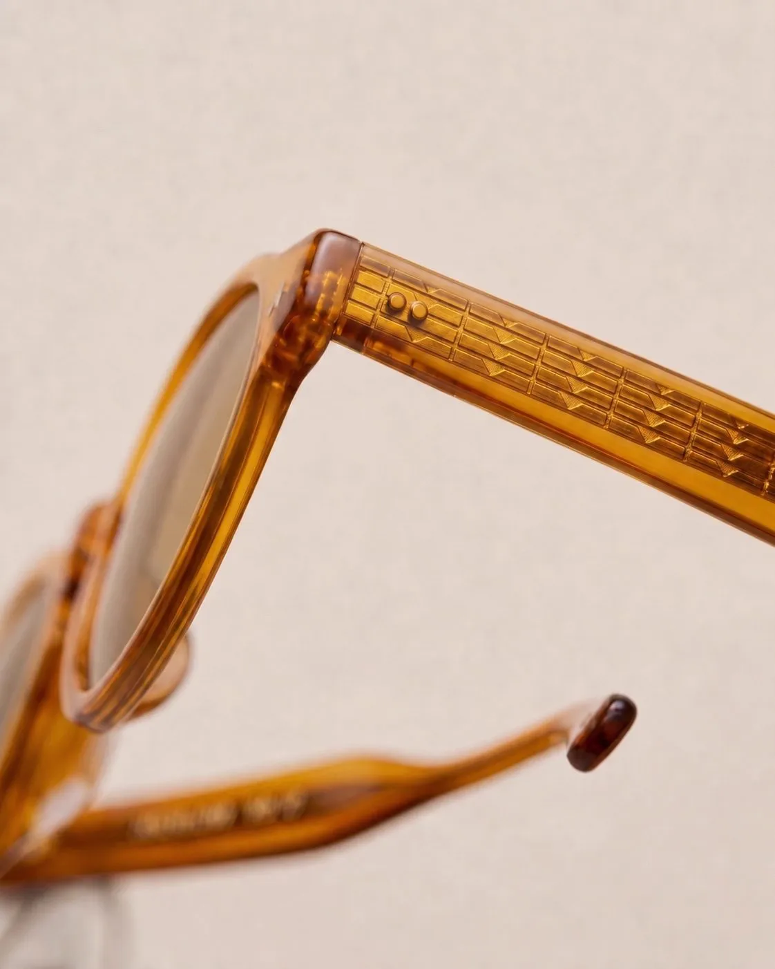 Textured wire core inside an amber acetate temple.