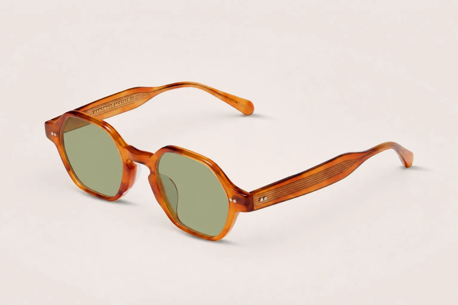 Honey acetate angular sun frame, three-quarter view.
