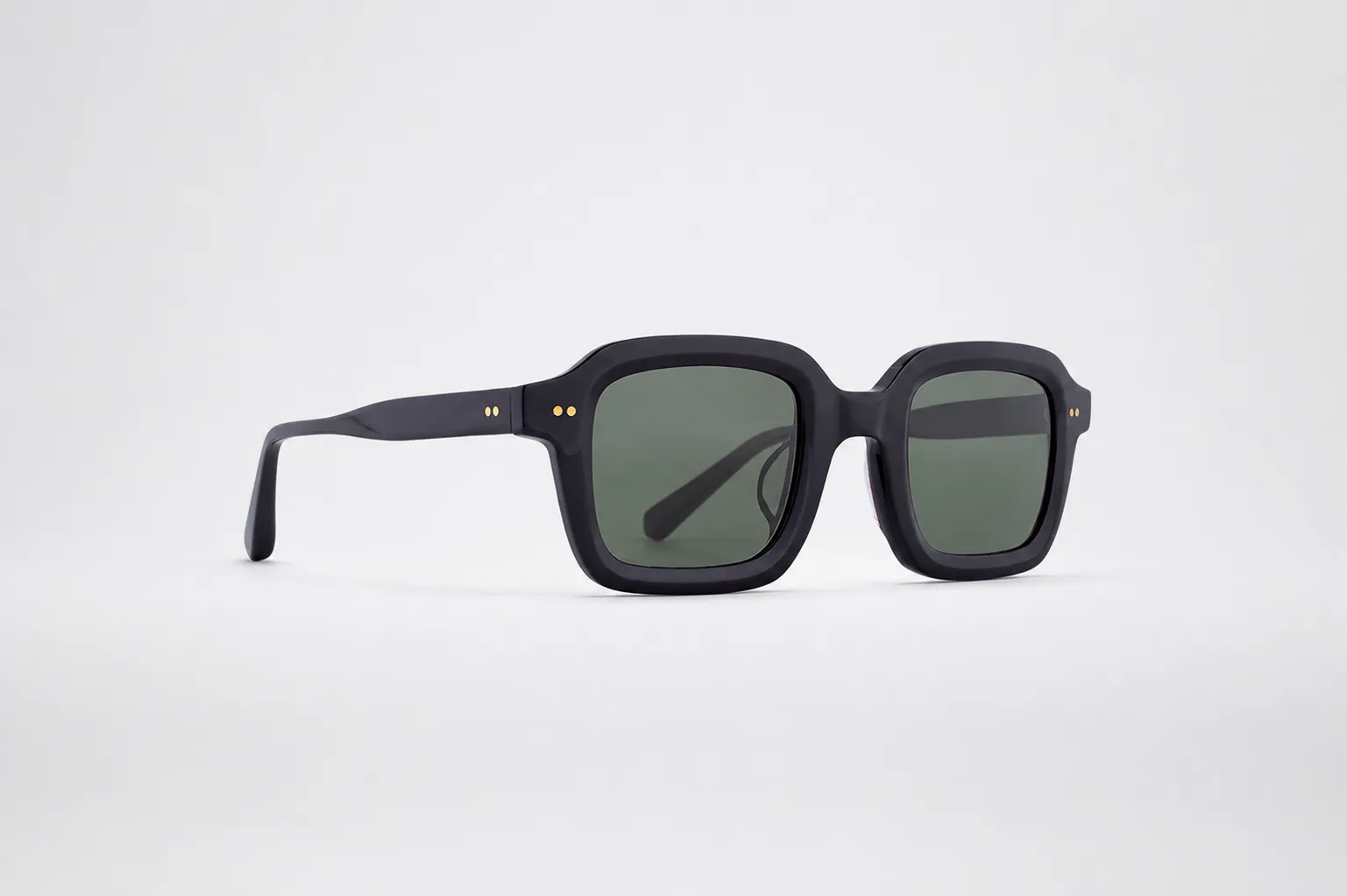 Square sun frame with green lens.